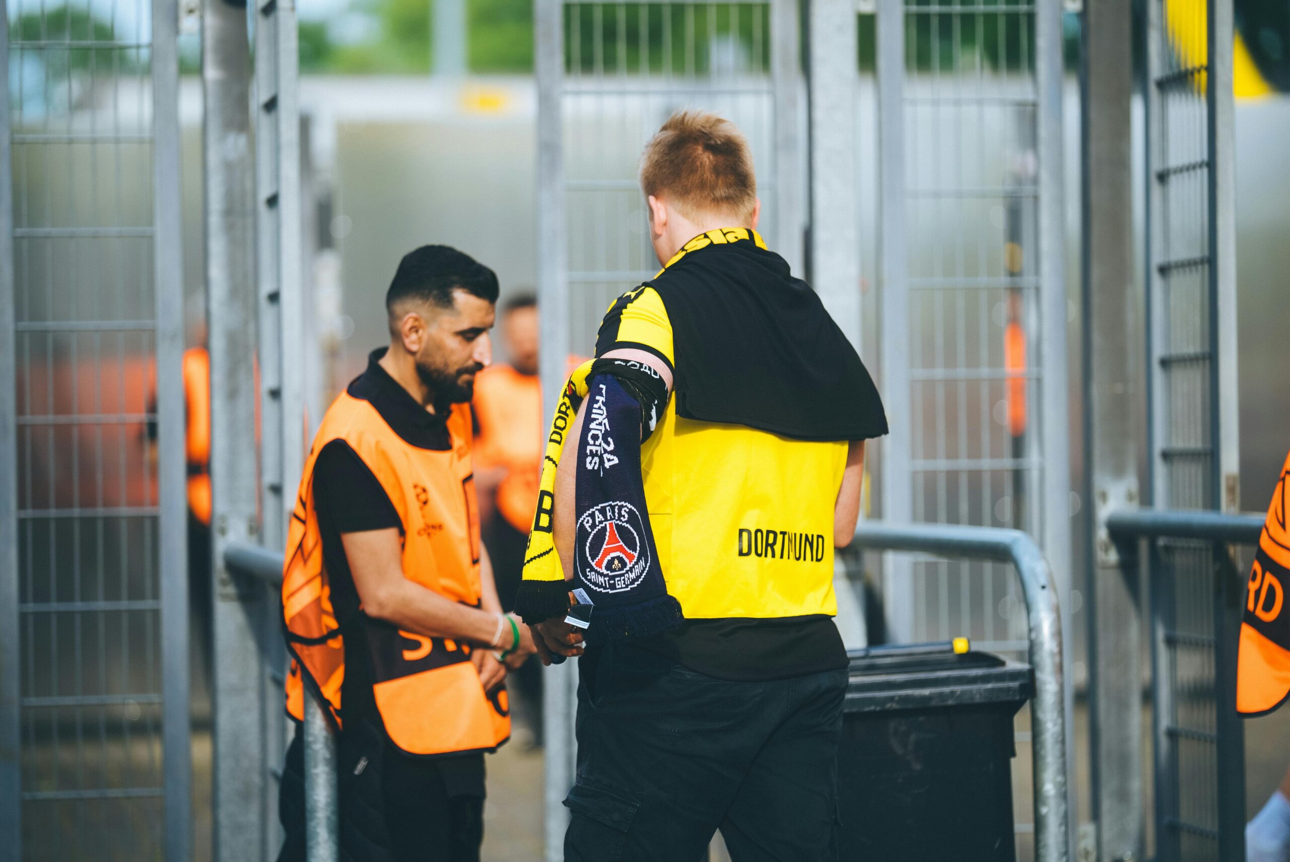 image of a security guard letting a male into an event